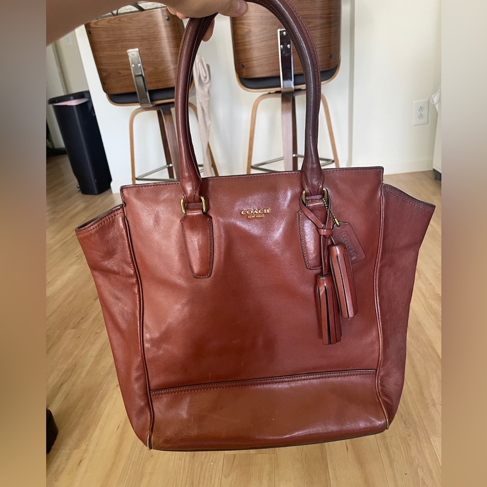 Coach soft lined tote 👜 genuine brown leather fits a 15 inch laptop has pockets